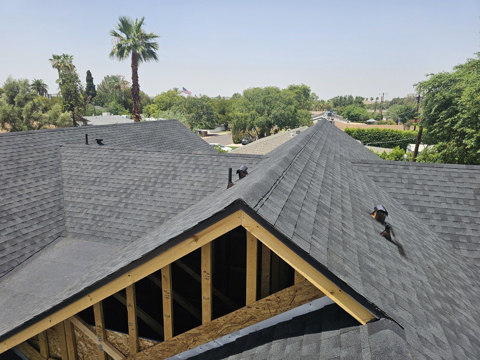 Roof framing and structural construction in progress